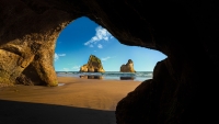 Collection\Msft\Landscapes: Looking-through-cave-opening-to-sea-shore